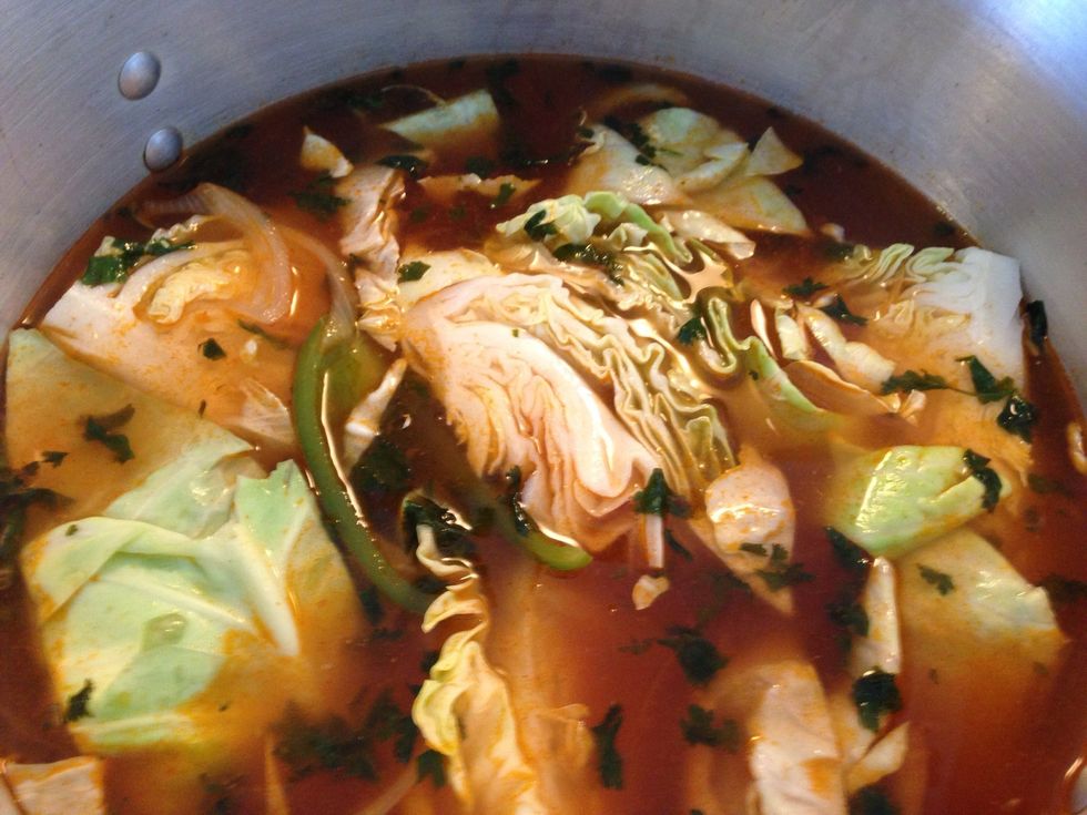 Now add your saut\u00e9 vegetables with the cabbage ....... Now lets wait to boil. Once is boiling add the fish....