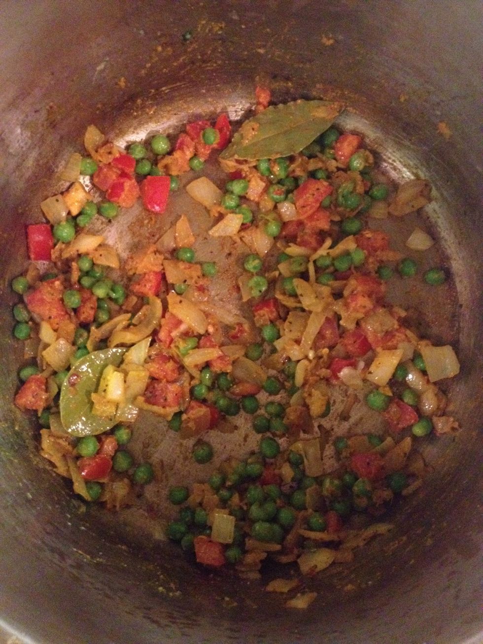 Now add your seasonings and bay leaves.. Stir constantly on medium high heat for five minutes