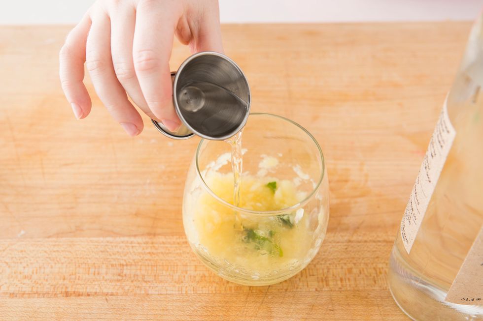 Now, add your simple syrup and muddle everything together.