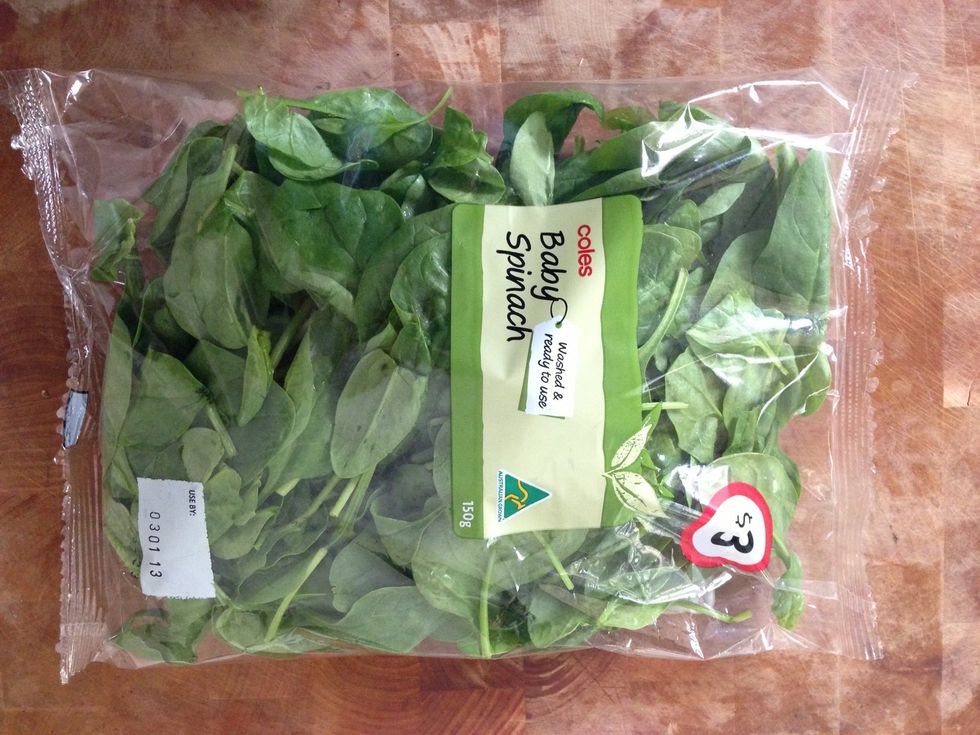 Now add your spinach... I usually buy 150g bags of spinach from my local supermarket and use the whole thing. It adds texture to the smoothie and with the berries and banana you don't taste it at all.