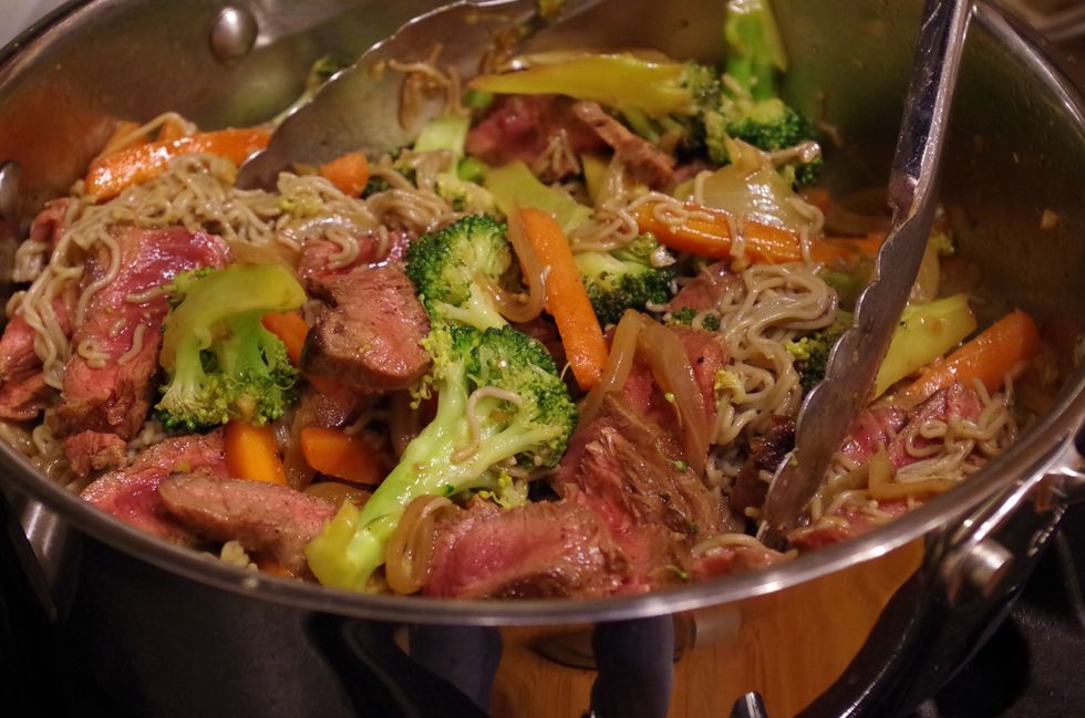 Now add your steak (along with the juices) and cooked noodles to the pan. You can also add 2 tbsp of toasted sesame oil and 1 tbsp coconut vinegar now. Stir to combine.
