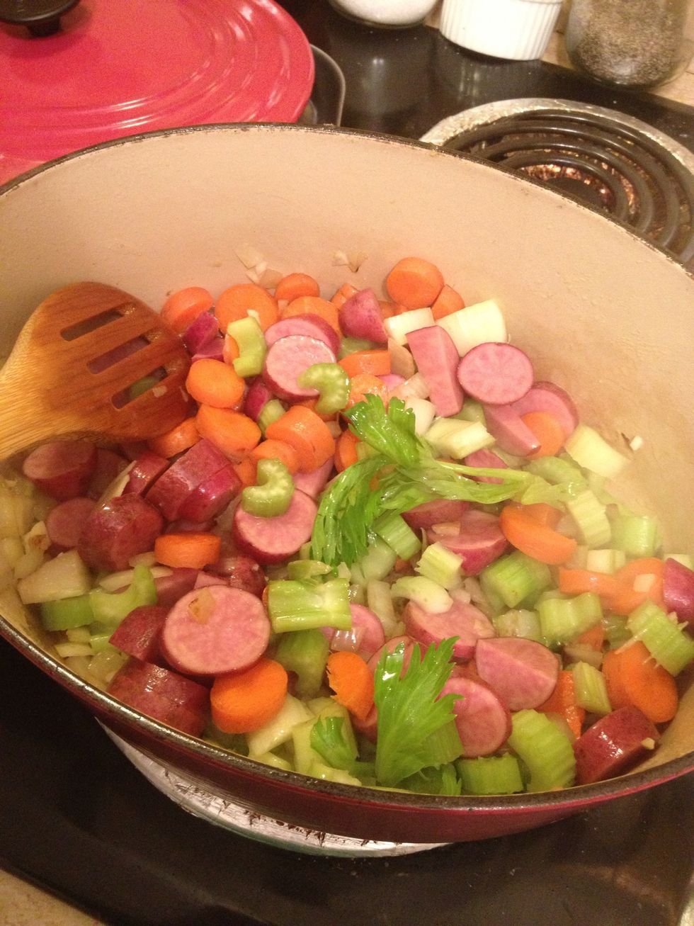 Now add your veggies. I drizzled a bit more oil to prevent from burning.(those are potatoes although they look just like sausage link...I'm sure you could add that too and it would be yummy.)