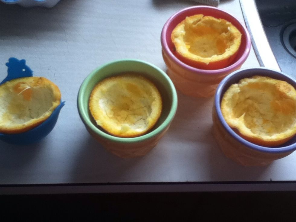 now after you've scooped the orange out, they should look like this. I put my orange peels in bowls, but cupcake tins work too!