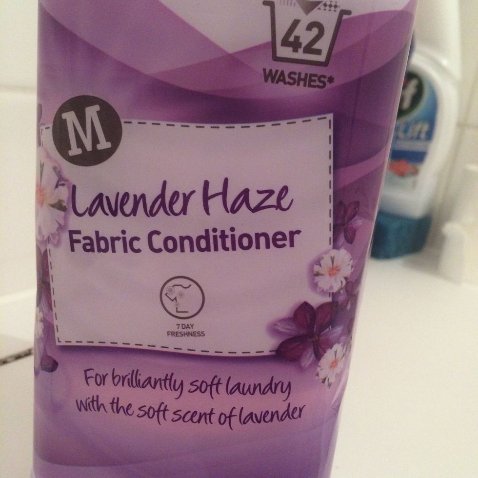 Now, after you've washed the fabric, get some fabric softener, and place a tiny amount in some fresh water.