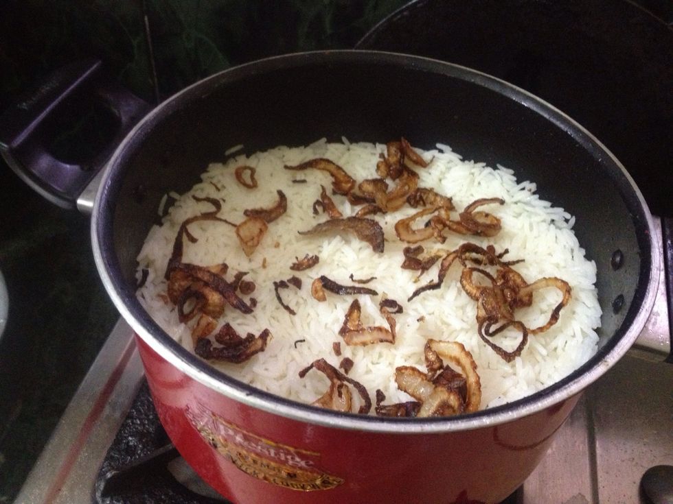 Now again add the fried onions as toppings on it... Then cook for 10-15 min in medium flame...