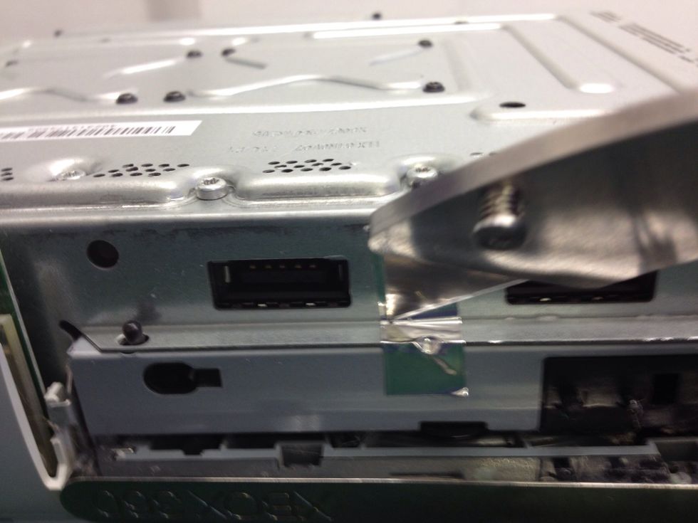 Now, again with your knife, slice along the warranty seal.