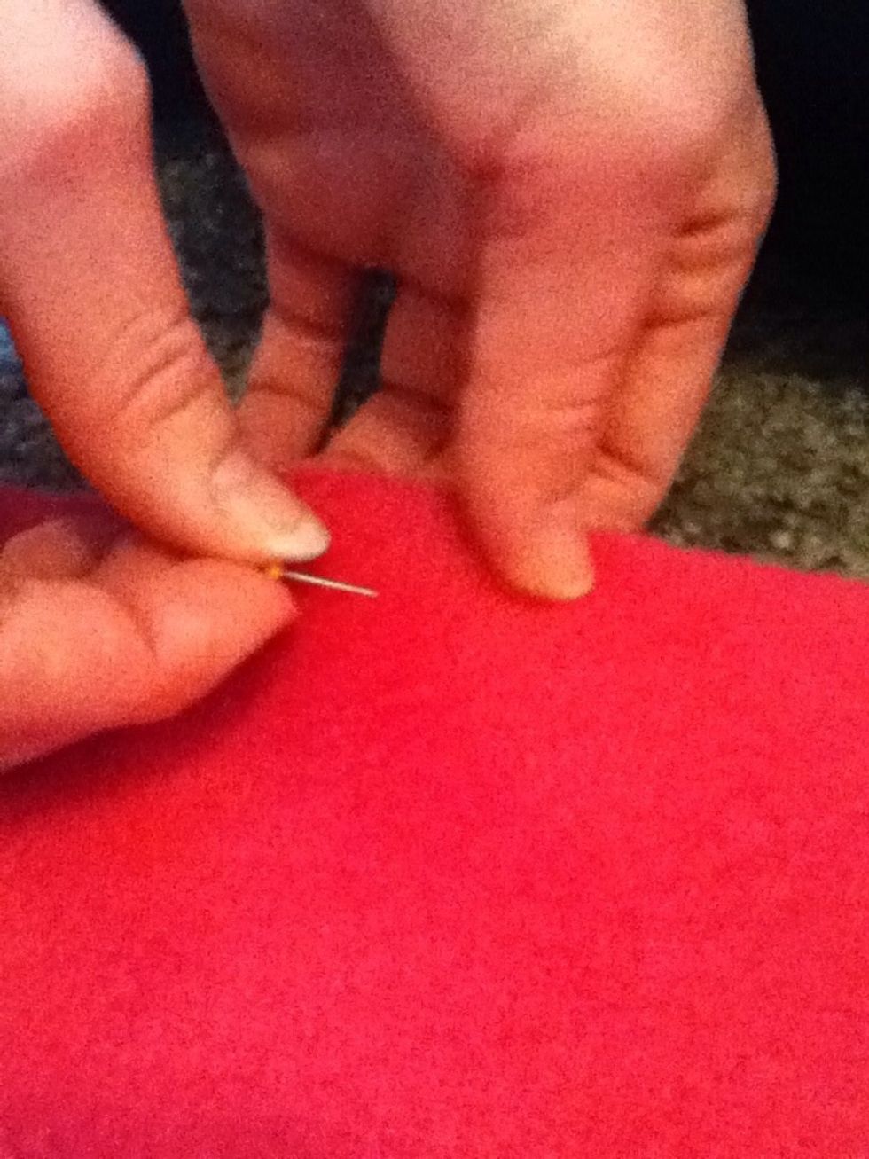 Now align the two trimmed edges and one short edge to pin them together each a 1/2 inch from the end as your trimming to reduce to movement of fabric.