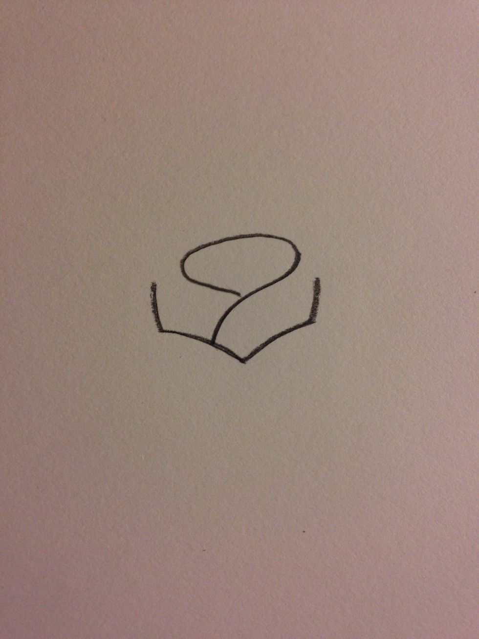 Now an oval connected to the edge of one of the first curves to make the inner petals