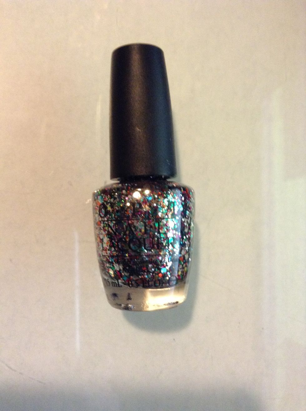 Now apply a coat of colorful glitter to both ring fingers or ( glam nails)