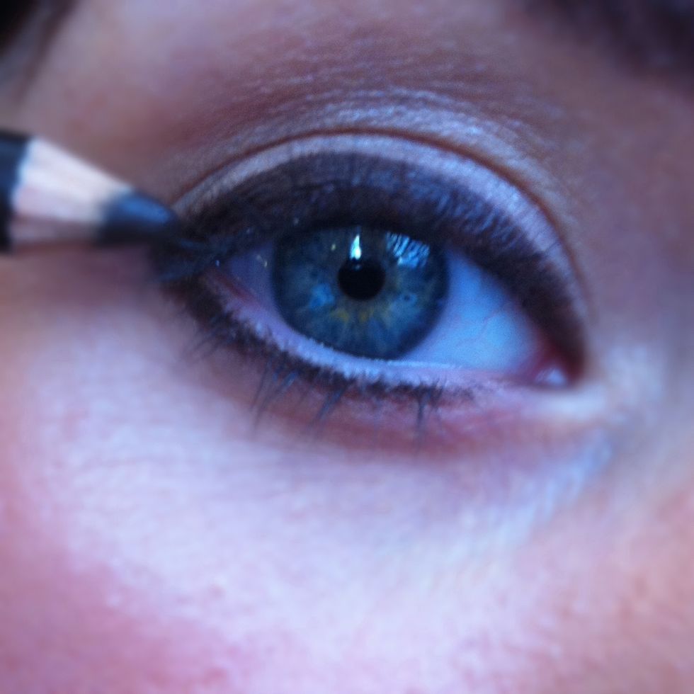 Now apply your black eyeliner to your top lash line.