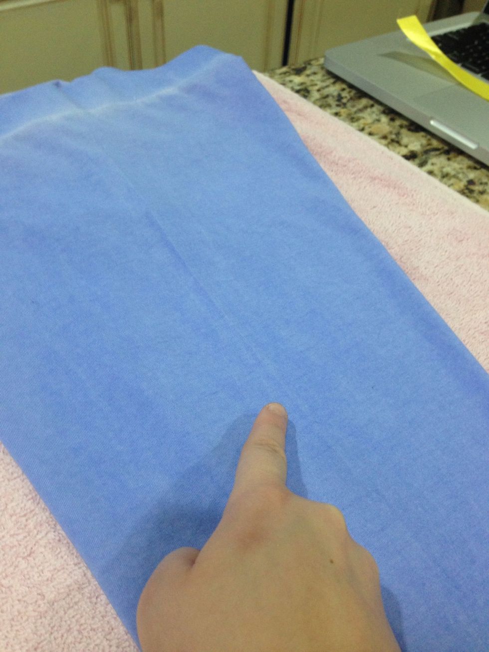 Now arrange the pants on the side you are going to add the ribbon to. You will see the crease where you will lay the ribbon on top of to fuse it to the pants.