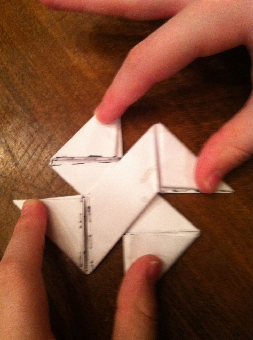 Now arrange them on top of each other with the edges clockwise.