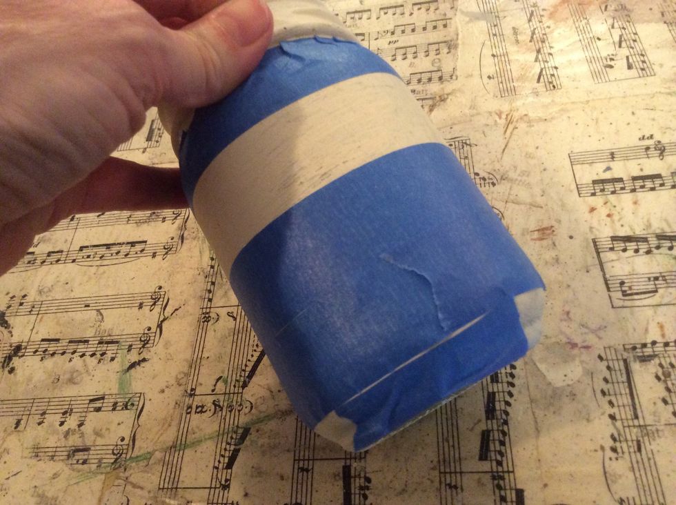 Now attach pieces to the very bottom under the 4th row of tape. It's easier to tear off smaller bits to work around the bottom of the jar.