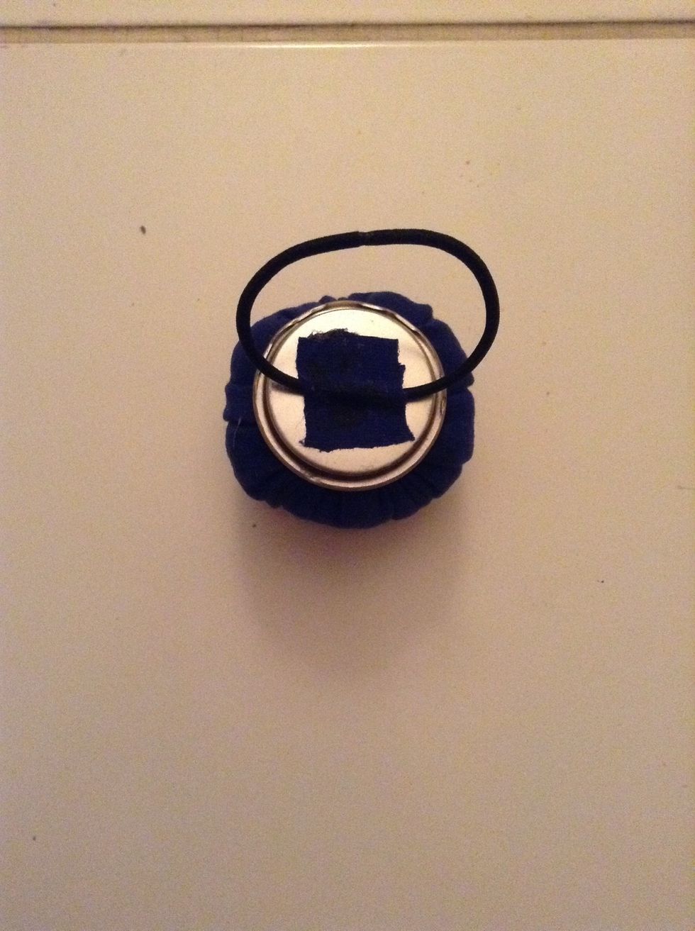 Now attach that to the center of the empty side of the cap and let it dry for a few hours.