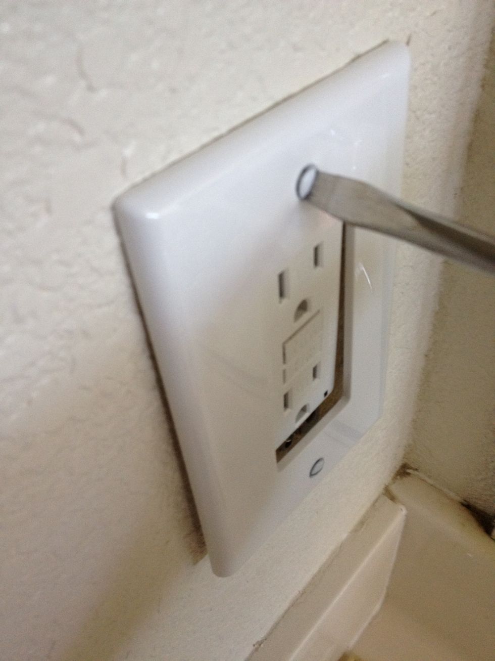 Now attach the new cover plate. Try and flush out the outlet and the cover plate as you screw it on so there is no change in plane between the two - this is a nice clean look.