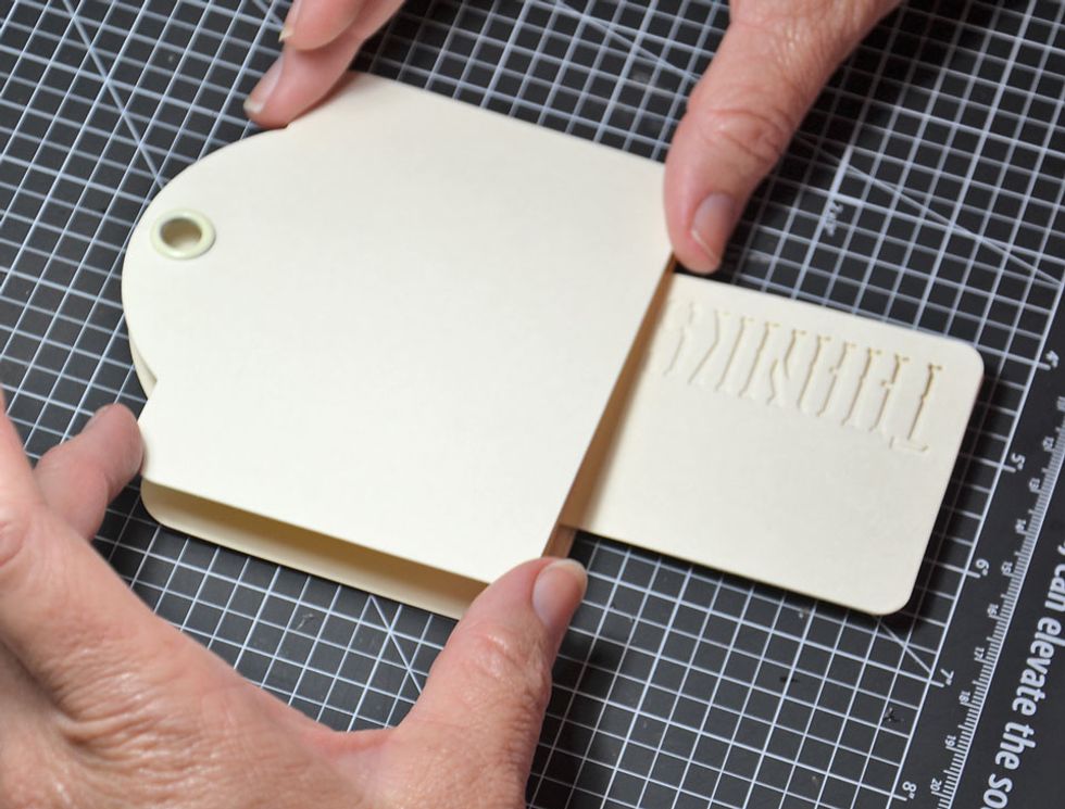 Now attach the top tag. Only glue around the edge of the tag as we want the small tag to push inside of it.