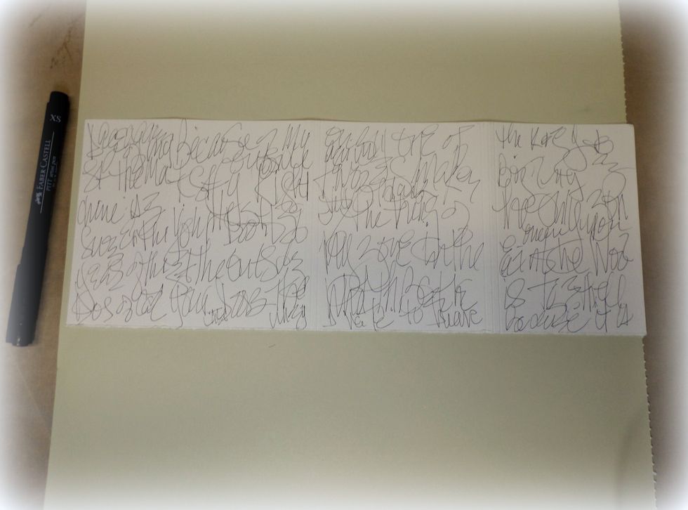 Now, back to the cover. Use a thin tipped marker to write some words on the front of the cover.