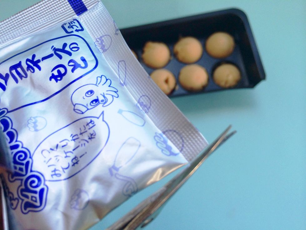 Now back to the mayo-- make sure top is still folded down - then snip a very tiny bit of bottom corner - you will use this to squeeze a thin steam of mayo into your Takoyaki