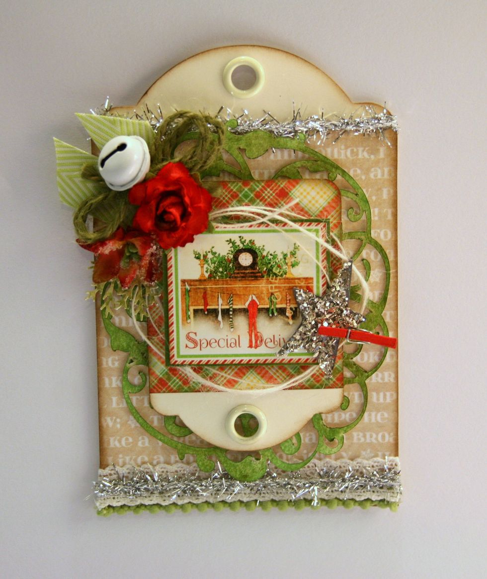 Now begin building up the arrangement with punched branches and smaller red sugared blooms.