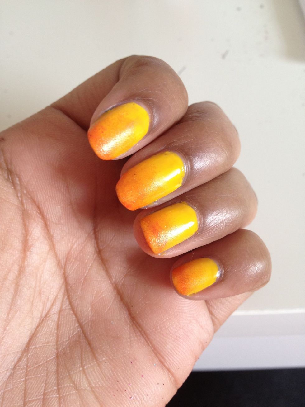 Now begin sponging the orange on to the nail little by little, and it should now look like a gradient