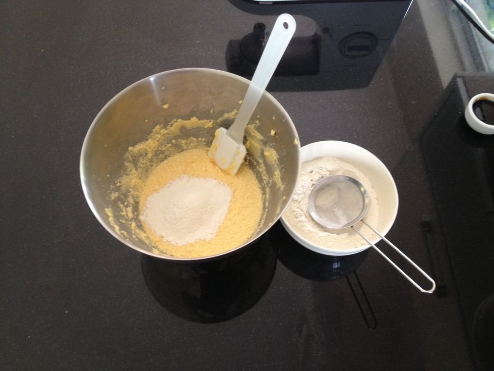 Now begin to sift in the Self Raising Flour a third at a time, folding it into the mixture.