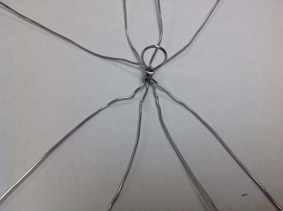 Now bend the original 4 wires around until they radiate evenly from the handle you just made. I did this on a flat surface with the handle pointing up.
