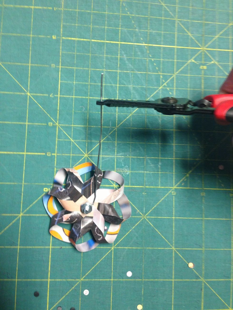 Now bend the other end of the paper clip to create a hook to hang the ornament with.