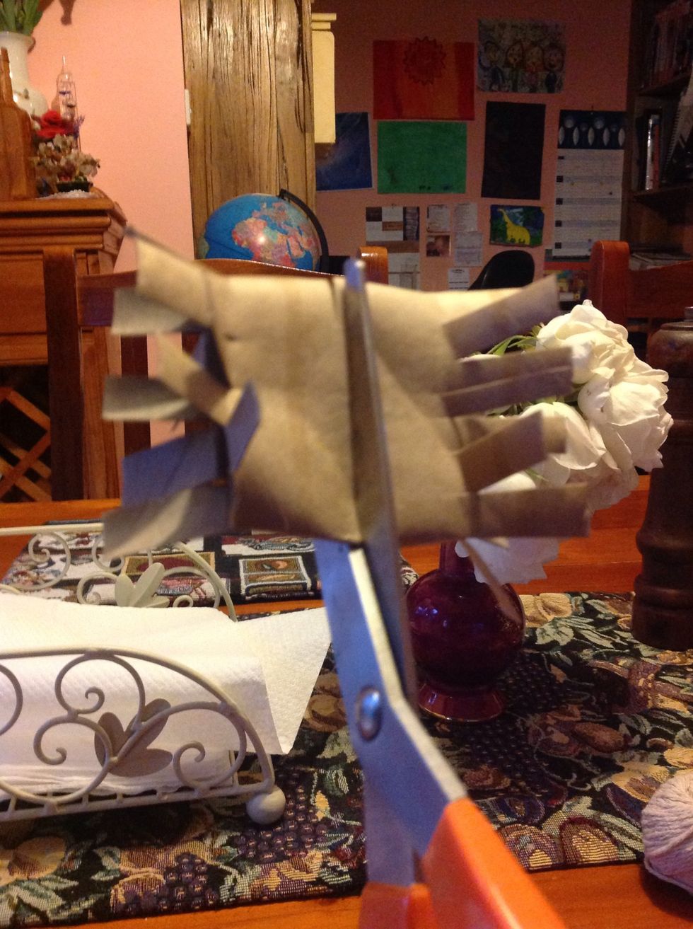 Now bend the roll around and now cut on each bend.