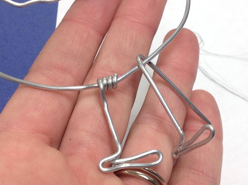 Now bend them around the bottom of your bird shape.