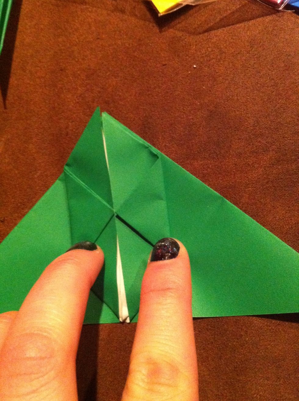 Now bring in the side corners to the center and fold so that it looks like the picture