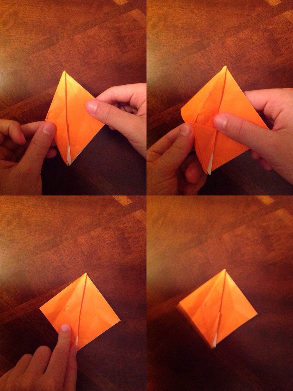 Now, bring the back flap on the right side to the left side by the underside of the paper.