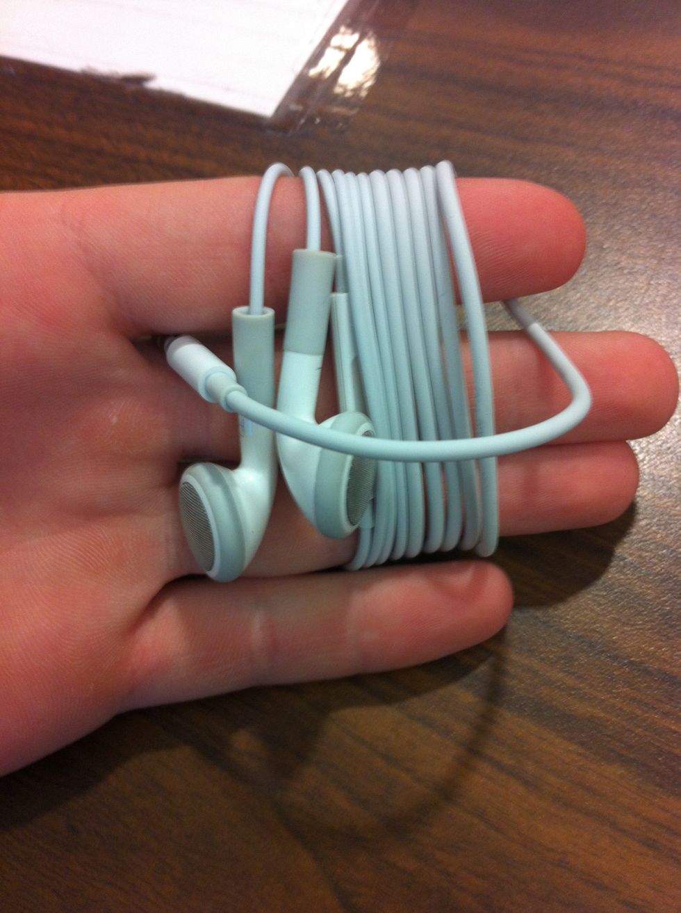 Now bring the plug across and over all the loops, and come through the space you created earlier between your fingers.