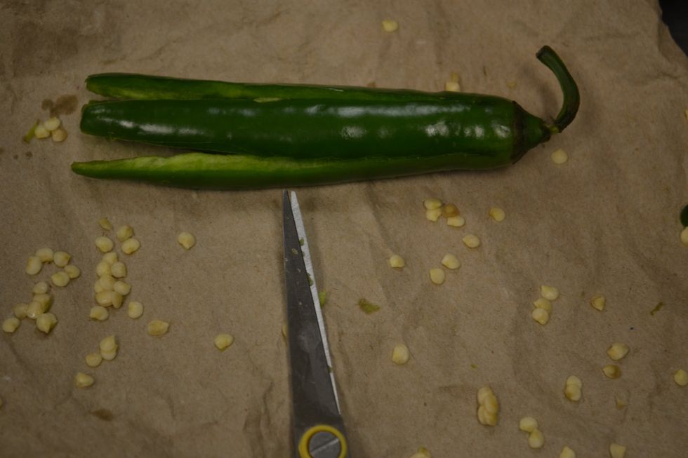 Now carefully with your shears scrape out the seeds,