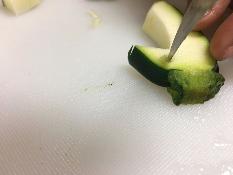 Now carve the eyes into one side by digging the knife in the Zucchini where an eye would go, and turn your knife in a circle.