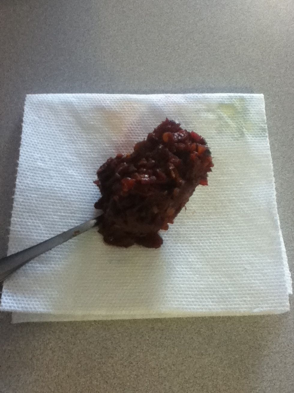 Now check this out. Good cooks don't waste anything, so you see this mass of seeds and skins we had left over in the sieve? You're gonna put that in a ziplock and freeze it.
