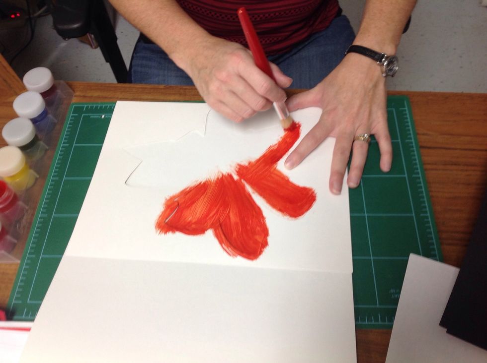 Now choose a base color and hold the stencil in place and paint away. Be careful to not push paint underneath your stencil.