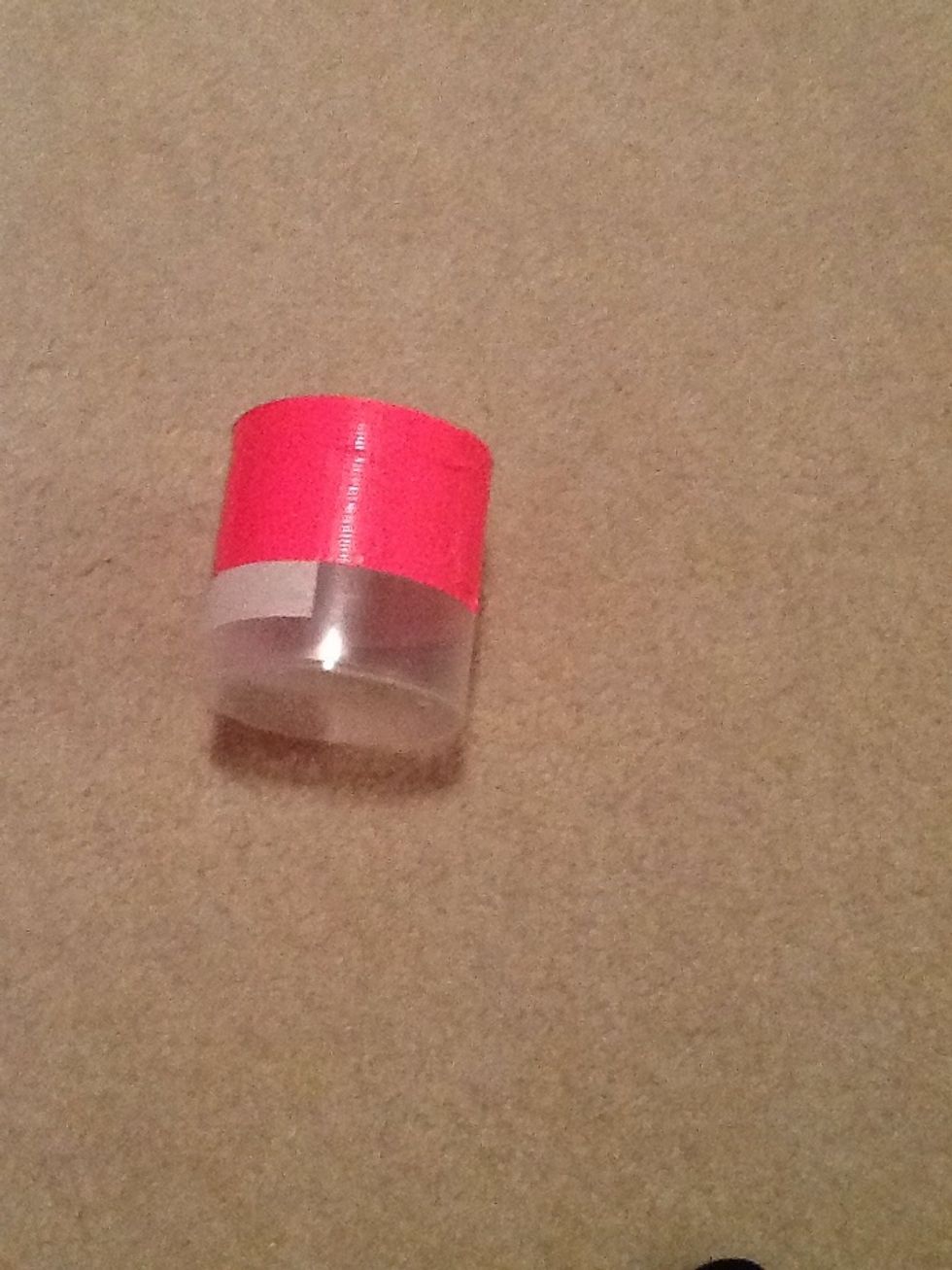 Now choose a color of duck tape and begin wrapping it around the container.