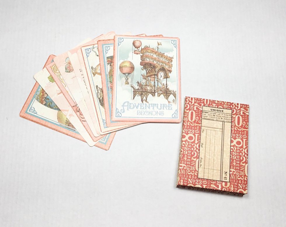 Now choose small ephemera cards to use as your pages.