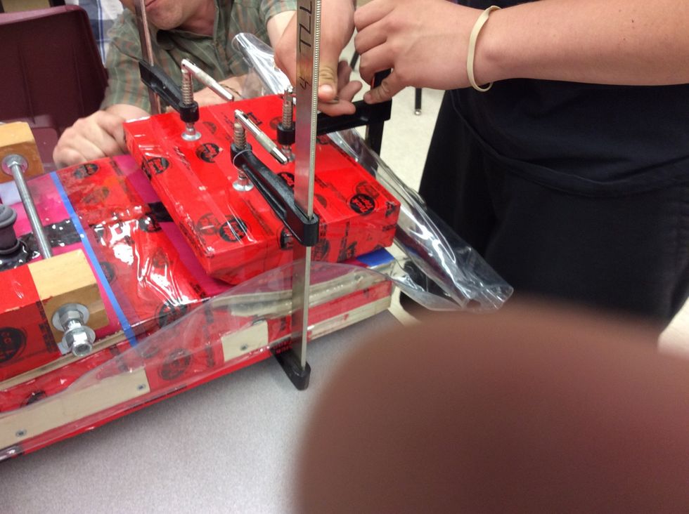 Now clamp your curved foamed blocks onto each end of your board. Use 3 F-clamps on each cual to hold it's place. Make sure that when you clamp the sealed part you wrap it and clamp it nicely.