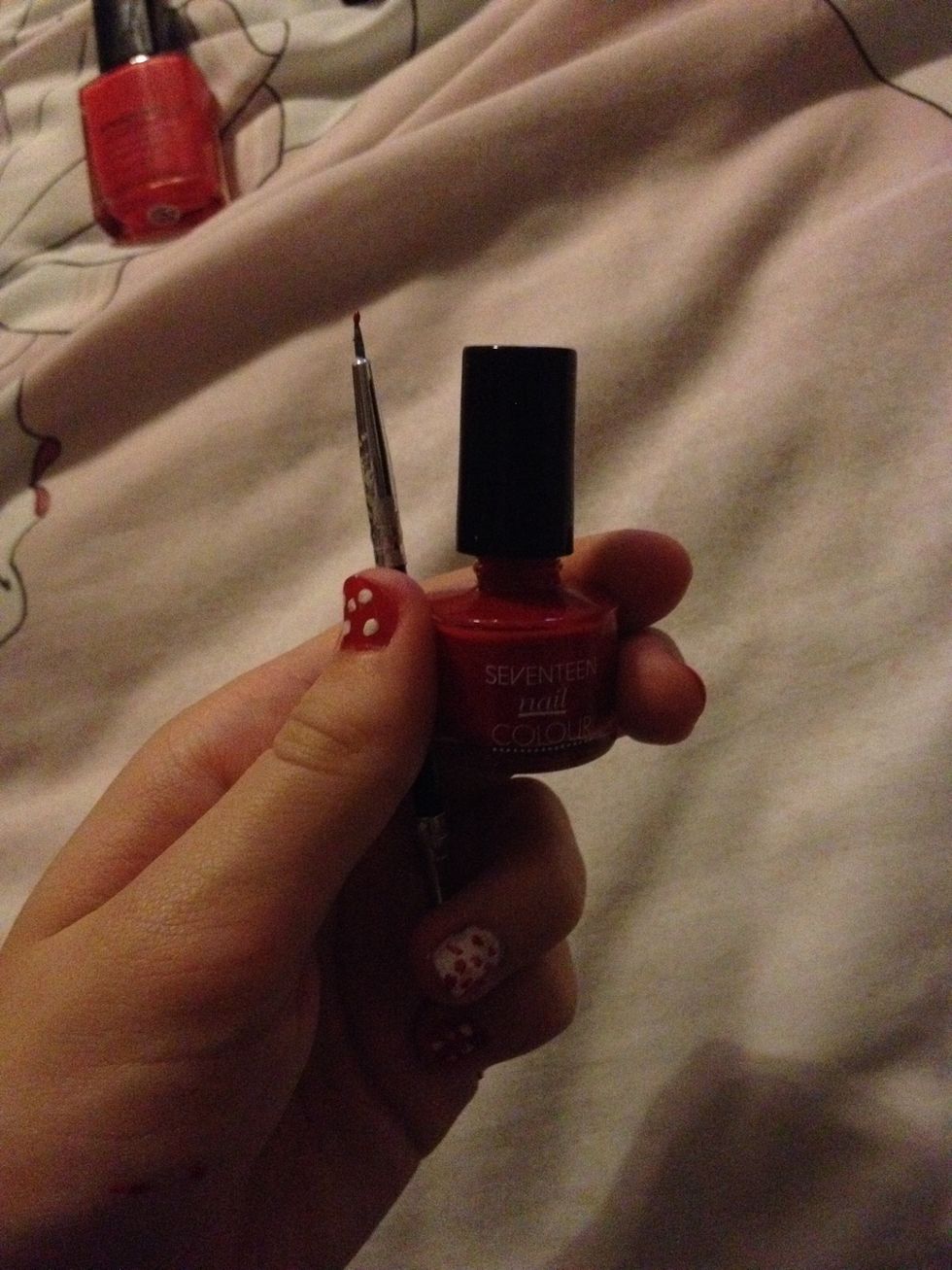 Now clean your dot tool and get your red nail polish