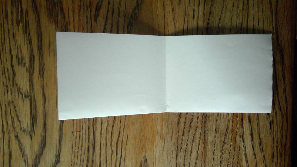 Now, close it back up and fold it the other way, so you have a quarter fold.