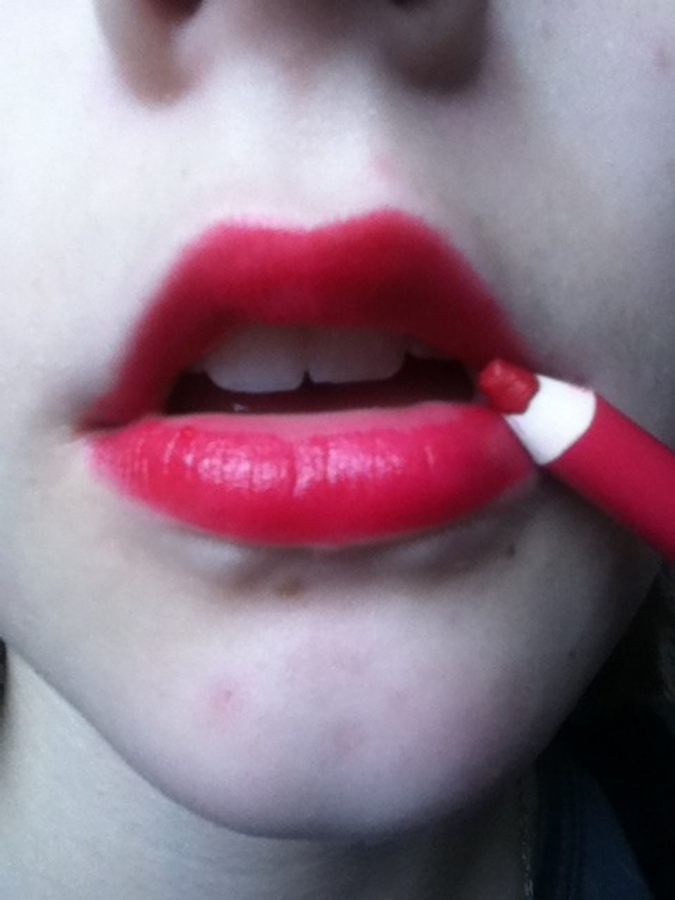 Now colour in your lips with the liner.