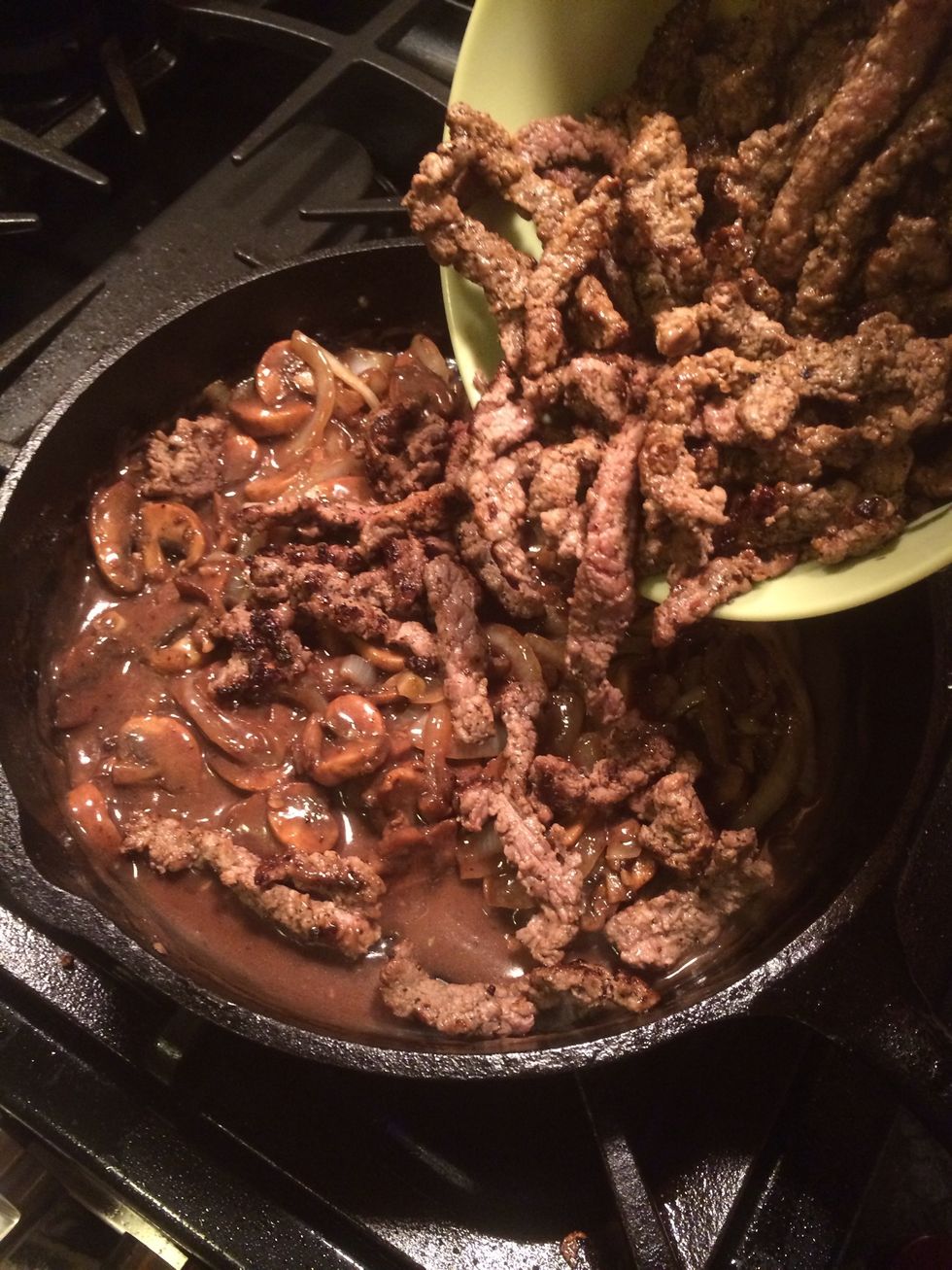 Now comes the beef. It is the last thing we want to add to the hot gravy. We don't want to continue cooking the beef. This will happen if we leave it in the gravy too long, so lower the heat to low.