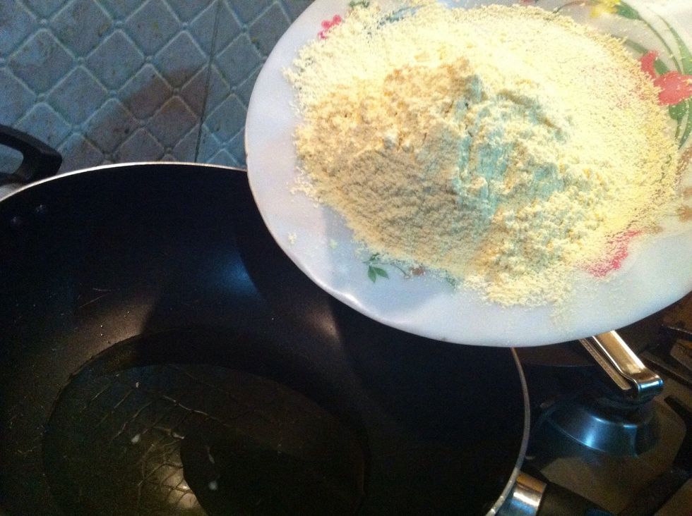 now coming towards my pan .. add besan (gram flour) to heated ghee and make sure heat is set to medium to low