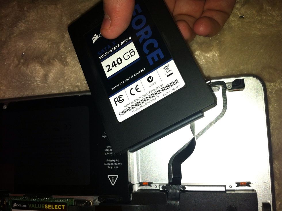 Now connect your new drive and put in place right edge first