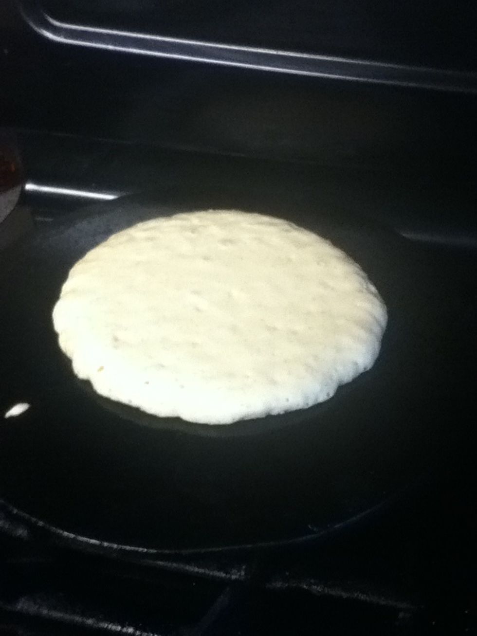 Now cook your pancakes......they will be ready to flip when it bubbles up...you can see some bubbles in this picture.....but its not ready to flip...it needs to have more bubbles!