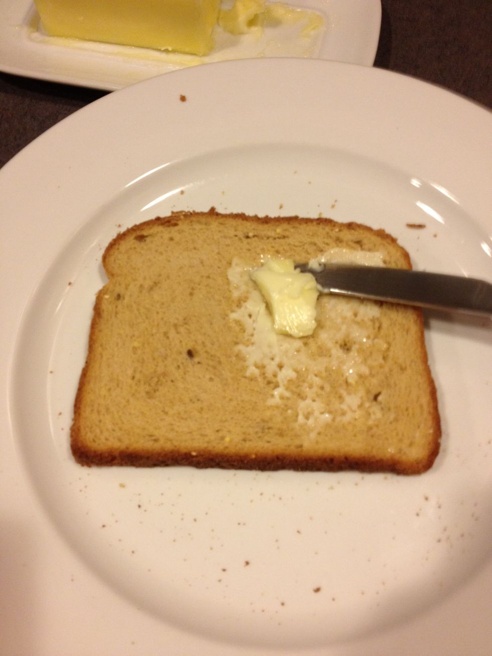 Now cover side two in butter. Important to do both sides & edges of bread because you will end up flipping the bread halfway through, the butter helps cook / not burn.