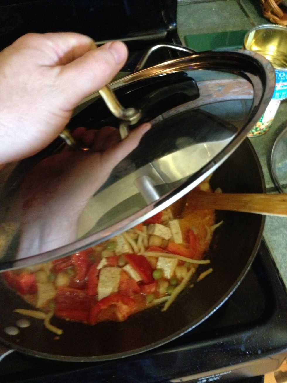 Now cover up your pot with a large lid. I like to leave the spoon sticking out so that there's a bit of ventilation.