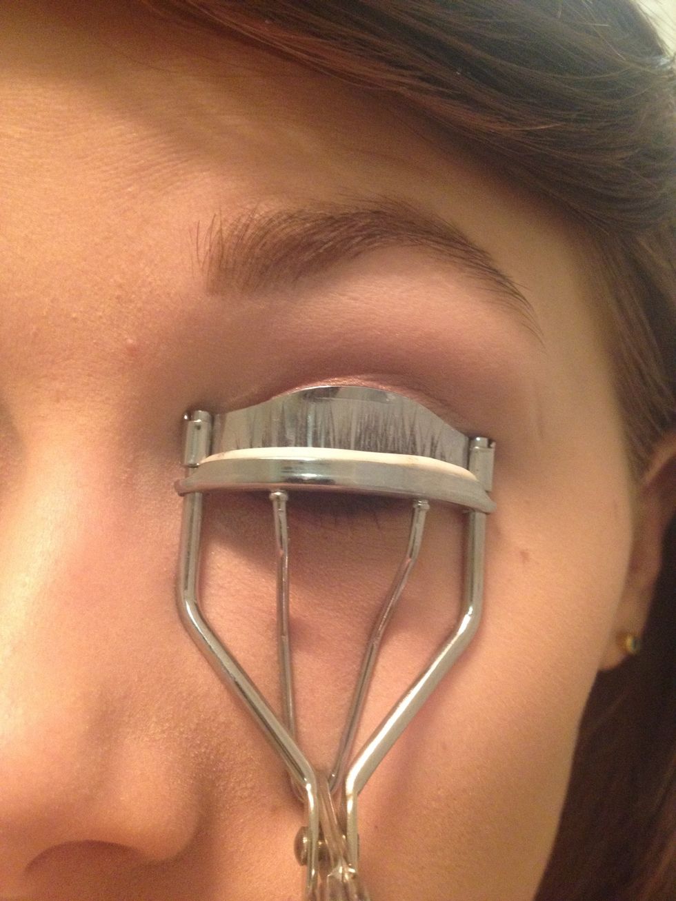 Now curl your lashes. Hold the curler for about ten seconds squeezing every now and then