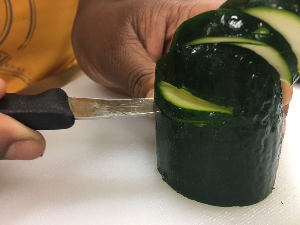 Now cut a little further away from the cut you made, and cut it the same way you cut the one above it. Making sure to connect the bottom and top, so it could be slide backwards.